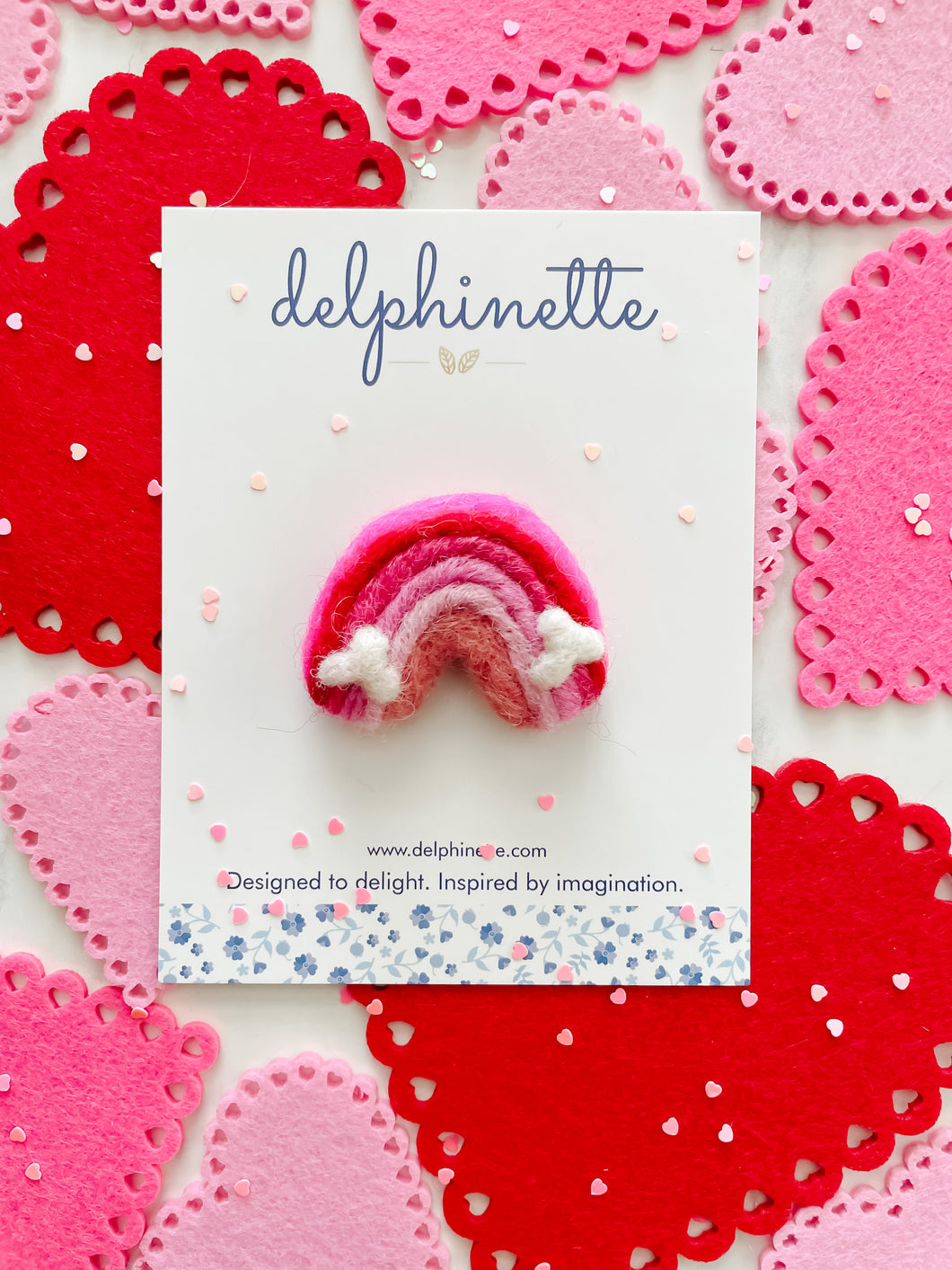 delphinette handmade felt little girl/baby girl hair accessory - a little pink and red gradient rainbow that can be customized as a hair clip, headband or hair tie. Handmade in Canada.