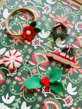 Load image into Gallery viewer, delphinette handmade christmas tree on car hair accessory, hair clip, headband, hair band, hair tie - green tinsel christmas tree on red car with gold sparkle panel and christmas red and white twine
